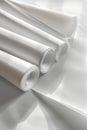Three rolls of white paper placed on a clean white surface Royalty Free Stock Photo