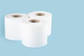 Three rolls of white toilet paper on a colored background Royalty Free Stock Photo