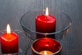 Three romantic candles in close-up. Home decor items. The light of the fire of paraffin candles