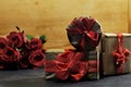 Three romantic gift boxes and red roses