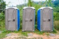 Three Rooms of Public Plastic Mobile Toilet in Forest