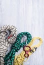 Three ropes neatly reeled up and lay on a light background