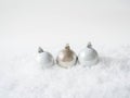 Three round christmas balls in the snow. Merry Christmas or Happy New Year composition. Copy space