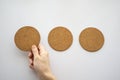 three round cork board and hand selecting the left Royalty Free Stock Photo