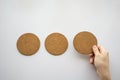 three round cork board and hand selecting the right Royalty Free Stock Photo