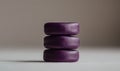 Stacked Purple Stones on a Neutral Background Royalty Free Stock Photo