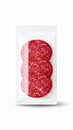 Three Round Salami Slices in Transparent Sealed Plastic Package on White Surface Royalty Free Stock Photo