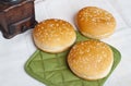 Three round sandwich bun with sesame seeds Royalty Free Stock Photo