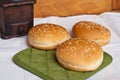 Three round sandwich bun with sesame seeds Royalty Free Stock Photo