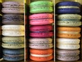 Three rows of colorful macarons (macaroons) french dessert in a box.