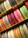 Three rows of colorful macarons (macaroons) french dessert in a box.