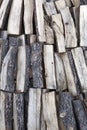 Three rows of wood logs stacked vertically and cut to burn in the fireplace Royalty Free Stock Photo