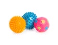 Three rubber balls with thorns pink, blue, yellow isolated on