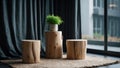 Three rustic wooden log stools and a potted plant displayed in a modern interior setting Royalty Free Stock Photo