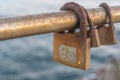 Three rusty Love padlocks over the sea Royalty Free Stock Photo