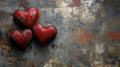Three rusty metal hearts on a textured weathered background Royalty Free Stock Photo