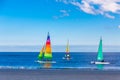 Three Sailboats at Beach