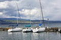 Three sailboats at the port in Yvoire