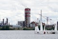 Three sailboats racing on the lake in the background .