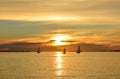 Three sailboats On the Sunset Royalty Free Stock Photo