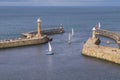 Sailing boats entering the harbour at Whitby Royalty Free Stock Photo