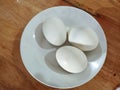 three salted duck eggs available on the table in a small plate Royalty Free Stock Photo