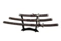 Three samurai swords on a stand on a white background Royalty Free Stock Photo
