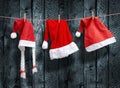 Three Santa Claus hat hanging on a clothesline Royalty Free Stock Photo