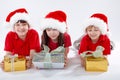Three santa kids Royalty Free Stock Photo