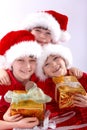 Three santa kids with gifts Royalty Free Stock Photo