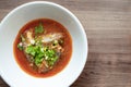 Three sardines in tomato sauce sprinkle on top with coriander and spring onion