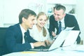 Three satisfied coworkers different sexes working in company off Royalty Free Stock Photo