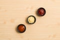 Three sauce in black bowl on wood background