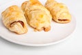 Three sausage rolls