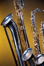 Three Saxophones on Yellow Royalty Free Stock Photo