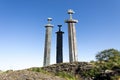 Three scenic tall vertical swords inserted in ground rock at the shores of Hafrsfjord fjord Royalty Free Stock Photo