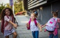 Three school girls outside Happy kids