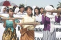 Three schoolgirls broom anti-corruption action