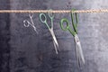 Three scissors hanging on a rope Royalty Free Stock Photo