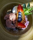 Three scoops of colorful ice cream with fresh blueberries Royalty Free Stock Photo