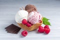 Three scoops of ice cream: white, brown and pink in a waffle glass Royalty Free Stock Photo
