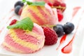 Three scoops of raspberry ice cream with fruit Royalty Free Stock Photo