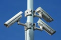 Three security cameras on power pole Royalty Free Stock Photo