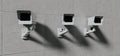 Three security cameras, surveillance mounted on wall, total control background Royalty Free Stock Photo