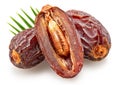 Three semi-dried dates or date palm fruits and palm leaves behind, isolated on white background. File contains clipping path