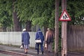 Three Seniors Walking Back From The Shops