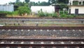 three sets of railroad tracks run straight