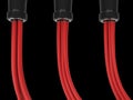 Three sets of red cables plugged in black jacks