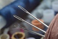 Three sewing needles are inserted into a spool of thread. close-up. Royalty Free Stock Photo