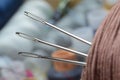 Three sewing needles are inserted into a spool of thread. close-up. Royalty Free Stock Photo